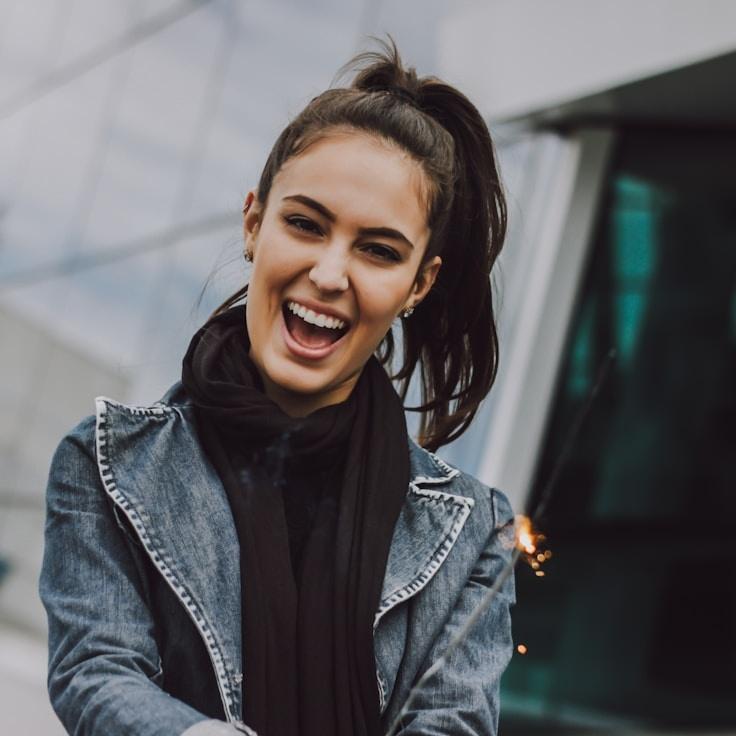 Mason Reed, Lead Design Curator at New Horizon Community, reviewing corporate floral arrangements